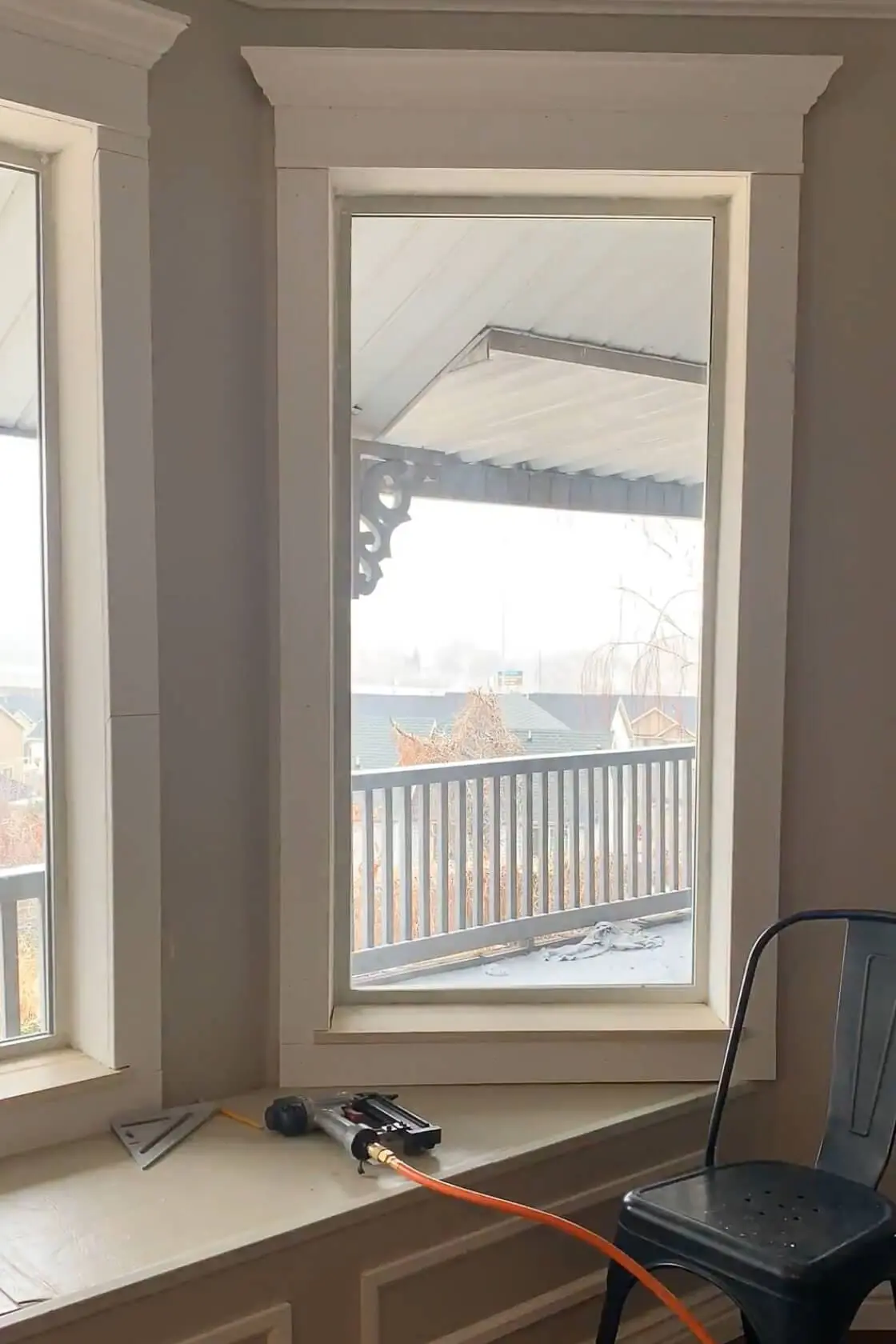 Finished window trim around a bay window.